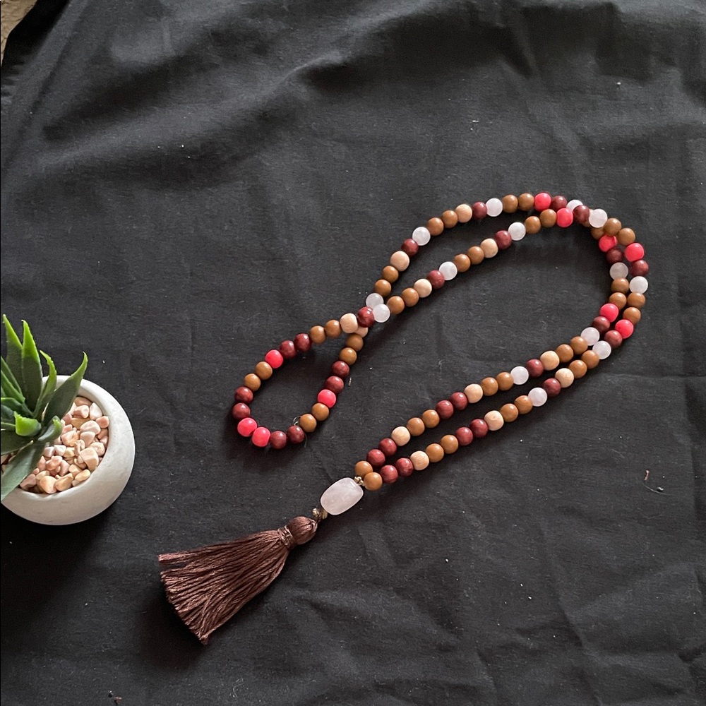 Hand assembled beaded necklace dark brown tassel